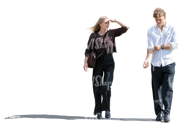 young man and woman walking and looking around