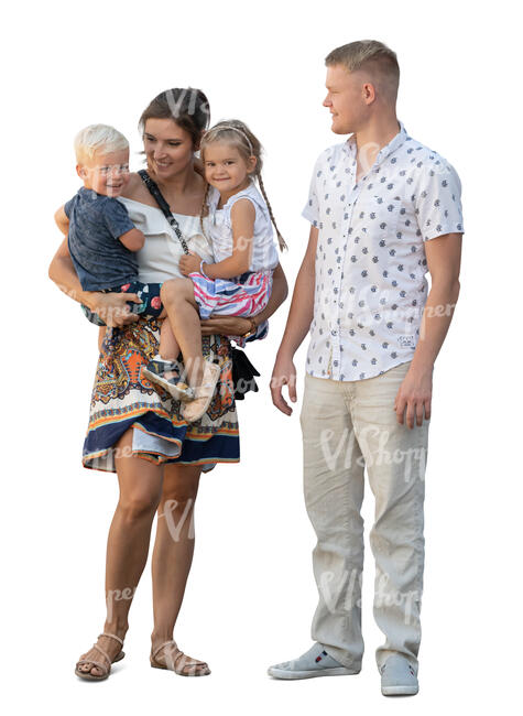 woman holding two children and her husband is standing by
