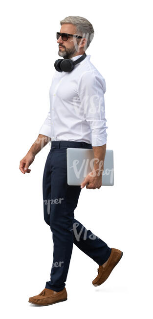 handsome businessman with a laptop walking