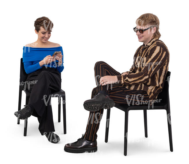 man and woman sitting and smiling