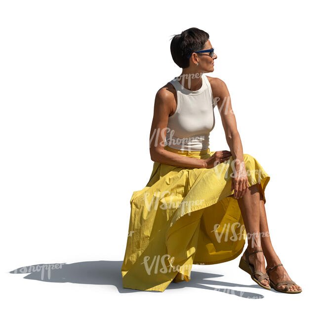 woman in a yellow skirt sitting in the sun