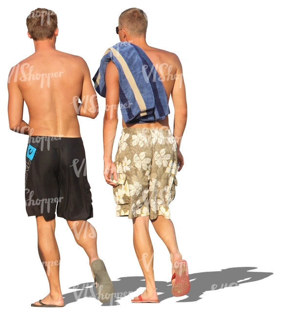 two men in shorts walking in the beach