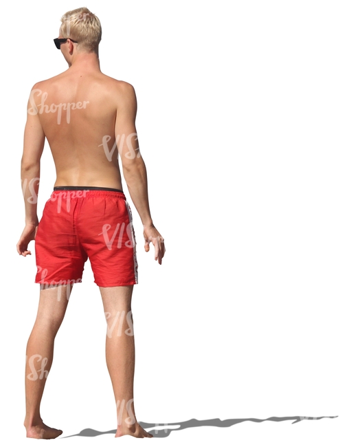 man in swimming pants standing barefoot