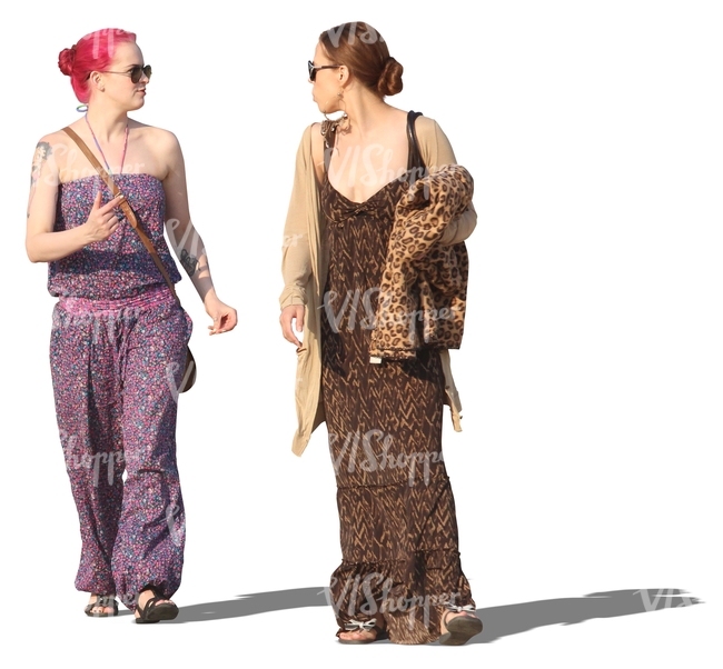 two women in summer dresses walking and talking