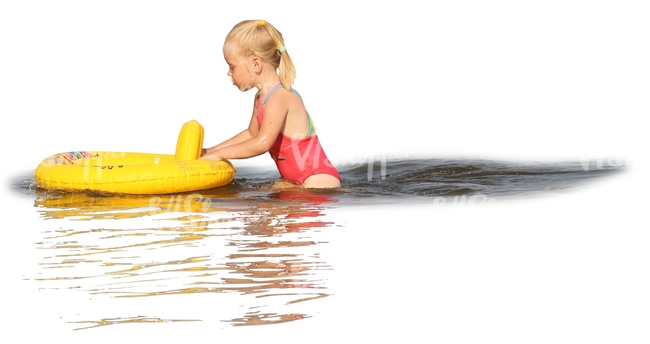 young girl with a toy playing in the water