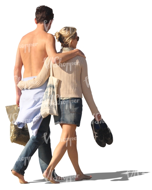 couple walking barefoot arm in arm