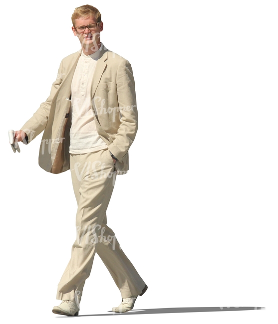 man in a beige suit walking