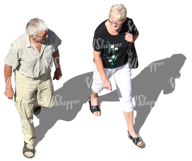 elderly man and woman walking