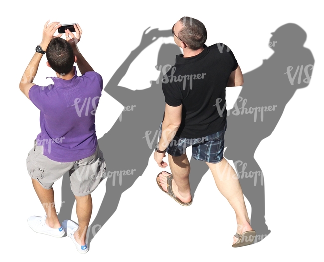 two men walking and taking pictures