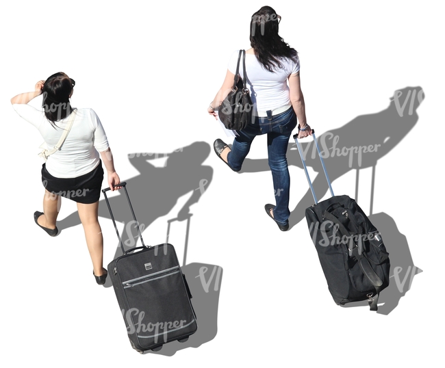 two women with suitcases walking