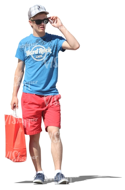 young man standing with a shopping bag in his hand