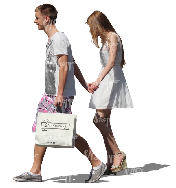 young couple with shopping bags walking hand in hand