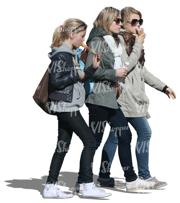 three girls walking and eating ice cream