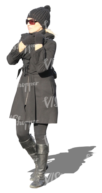 woman in a black winter coat walking