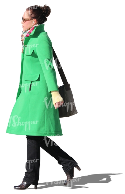woman with a green coat walking