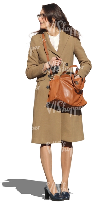 woman with a brown coat standing