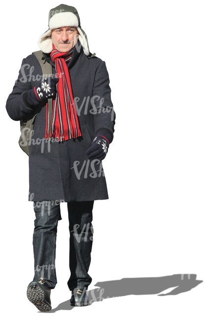 man with a red scarf walking