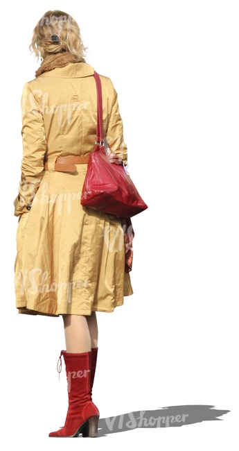 cut out woman in a yellow coat standing