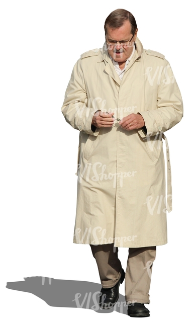 cut out man in a beige trenchcoat walking