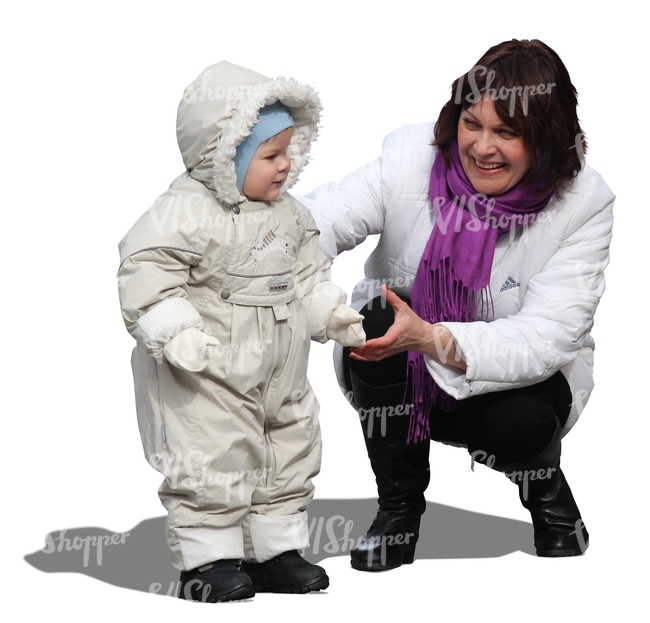 woman playing with a small child in winter
