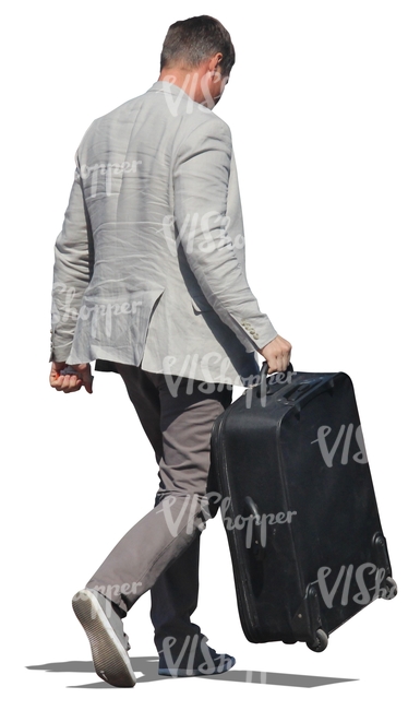 man in a suit carrying a suitcase 