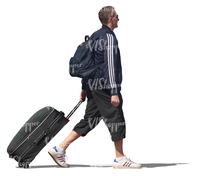 man walking and pulling a suitcase