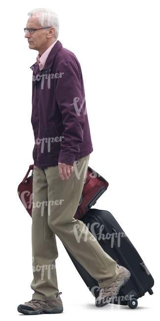 elderly man walking and pulling a suitcase