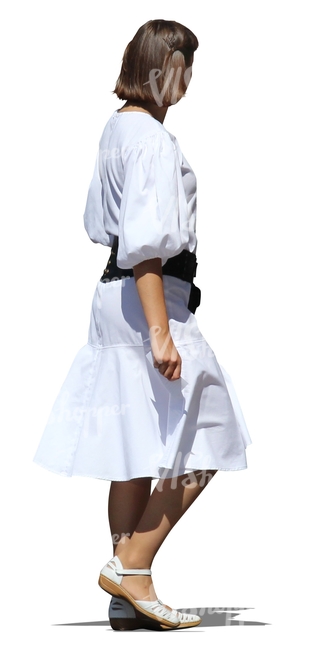cut out woman in a white dress walking