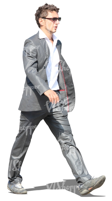 cut out man in a grey suit walking