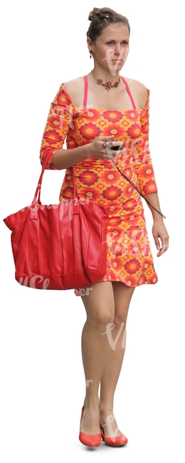 woman in an orange summer dress walking
