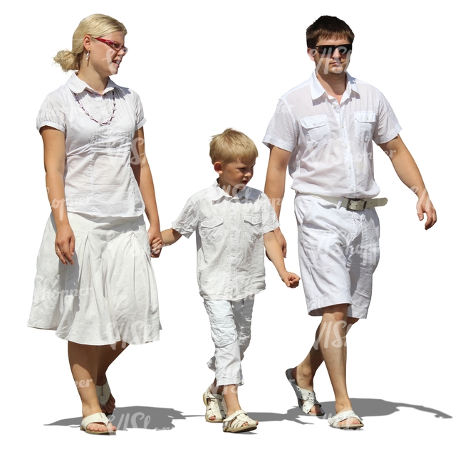 family dressed in white walking hand in hand