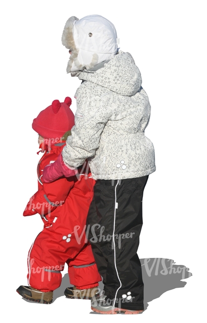 girl standing with her little sister in winter