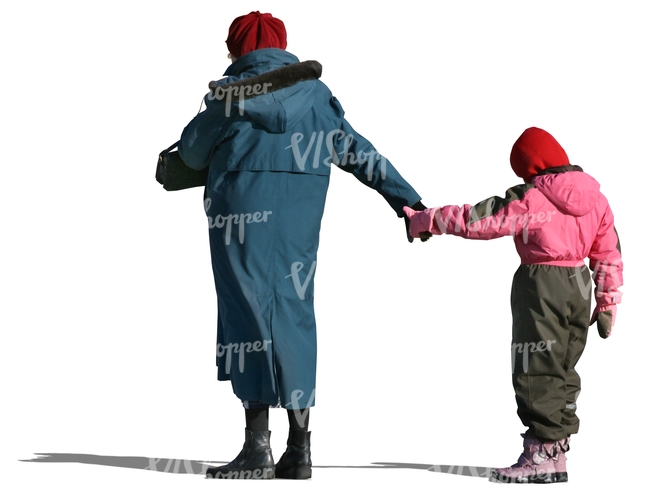 grandmother standing and holding a child by her hand