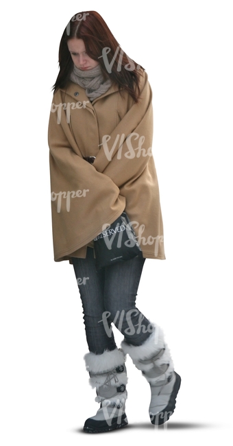 cut out woman in a brown winter coat walking