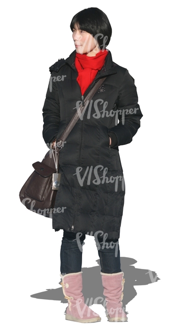 cut out woman in a black coat walking