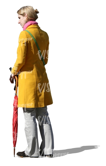 cut out woman in a yellow coat standing