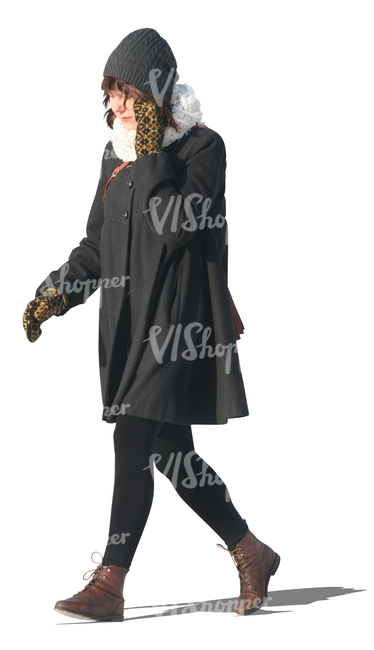 cut out woman in a black winter coat walking