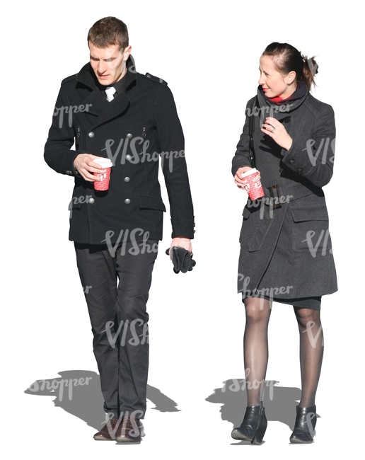man and woman walking and drinking coffee
