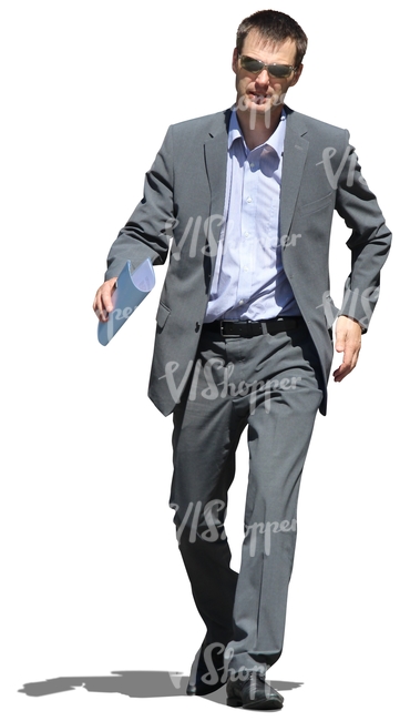 businessman with notes in his hands walking hastily