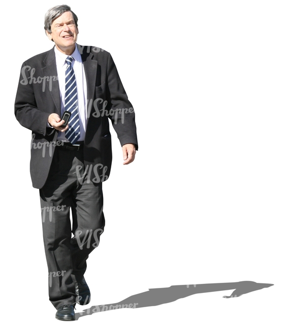 grey-haired businessman walking