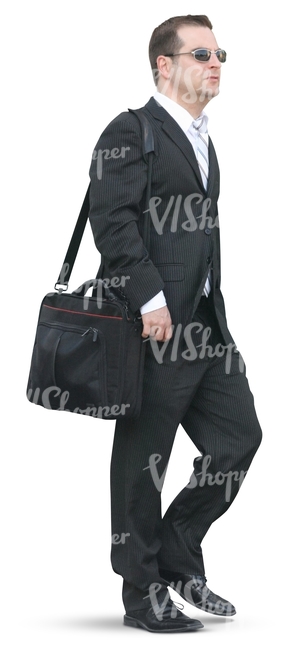 businessman walking with a bag over his shoulder