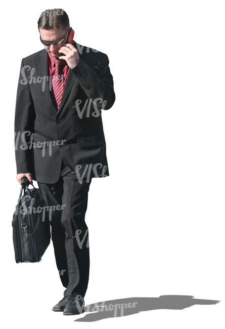 businessman with a briefcase talking on the phone