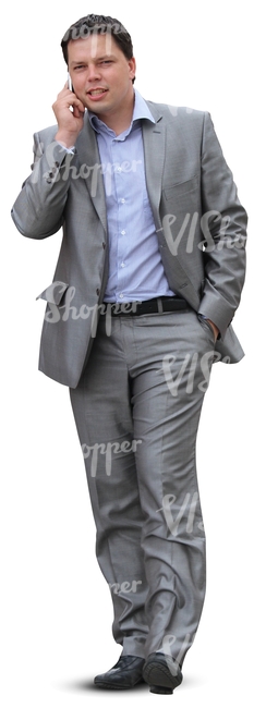 businessman in a grey suit talking on the phone