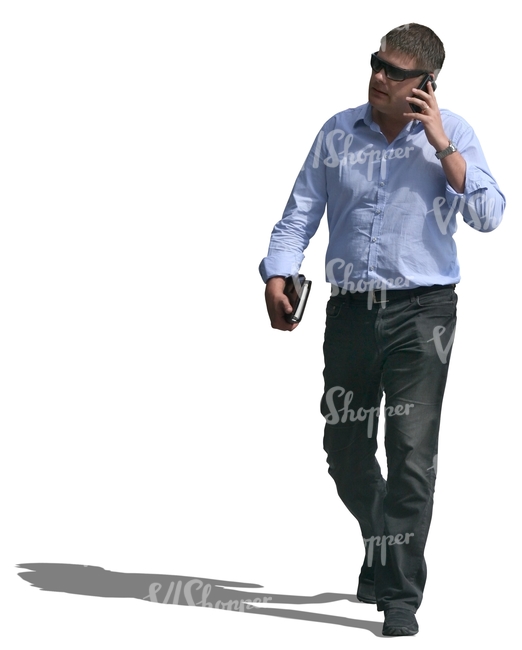 businessman walking and talking on the phone