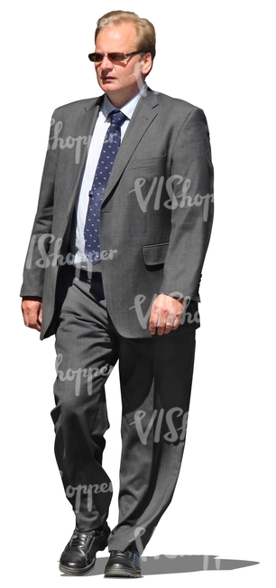 cut out businessman in a grey suit walking