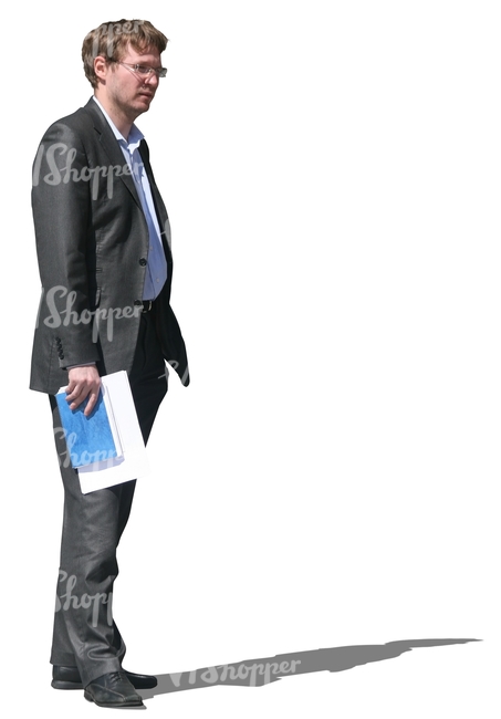 businessman standing with a notebook in his hand