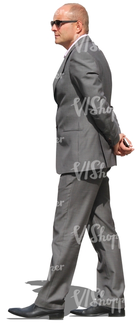 businessman with sunglasses walking