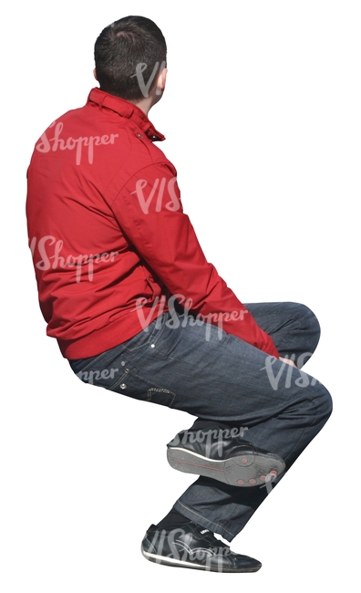 man in a red jacket sitting