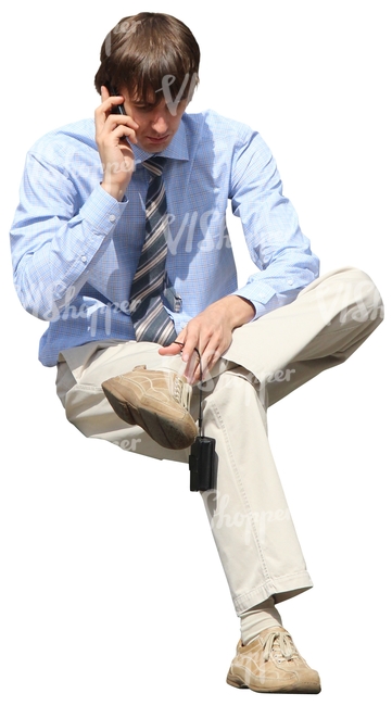 cut out businessman sitting and talking on the phone