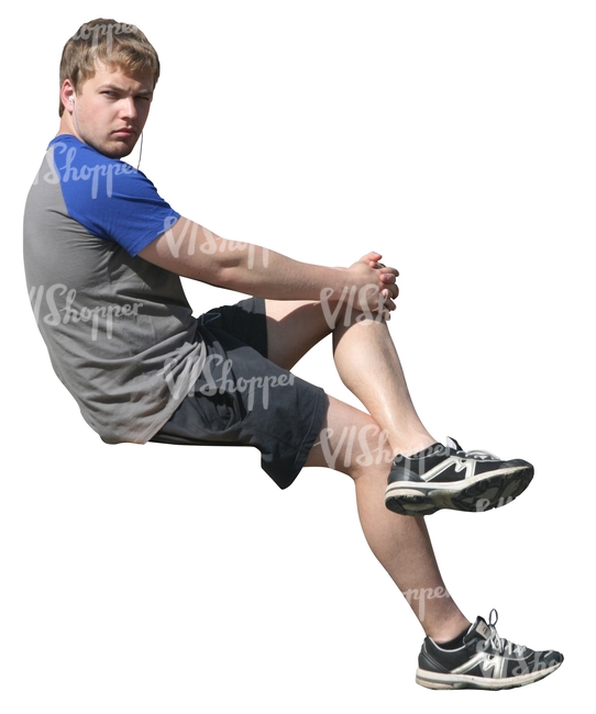 young man sitting and listening to music